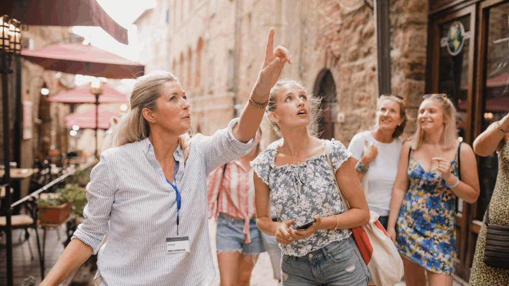 Tour guide showing tourists a historical site