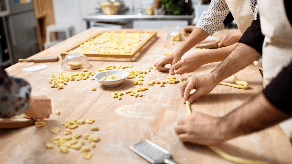 People making pasta in cooking class travel with purpose